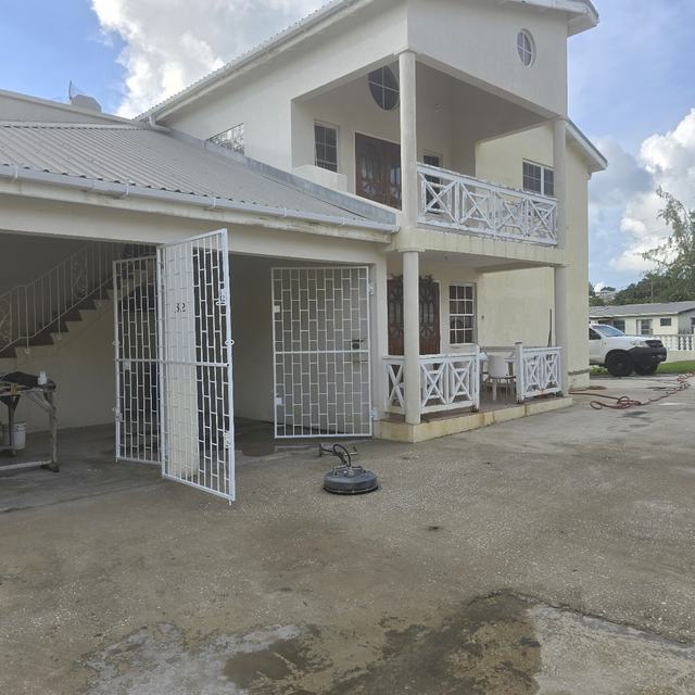 House and carport after pressure washing